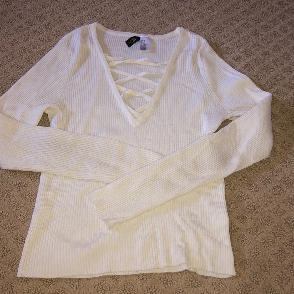 long sleeve t-shirt with open cross in the front.